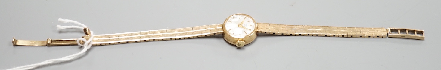 A lady's 9ct gold Tudor Royal manual wind wrist watch, on a 9ct gold bracelet with Rolex crown insignia on clasp, case diameter 18mm, gross weight 16.7 grams, no box or papers.